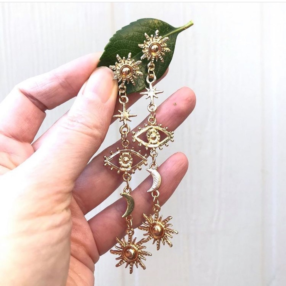 Celestial earrings in gold.